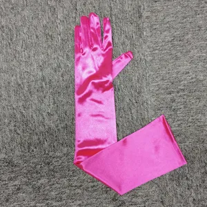 Hot pink satin long gloves detail view, elegant opera gloves for evening parties and weddings.