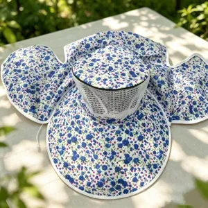 Detail view of the floral sun hat with wide brim, breathable mesh and protective neck flap.