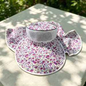 Detailed view of the women's floral sun hat with breathable mesh and wide brim.