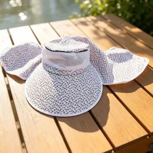 Floral print sun hat with wide brim and neck flap for outdoor summer sun protection and gardening.
