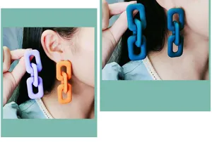 Detailed view of fashionable resin chain-link dangle earrings, showing colorful styles.