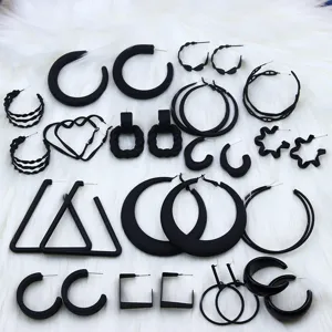 Set of black geometric hoop and stud earrings for women, fashion alloy jewelry accessories.