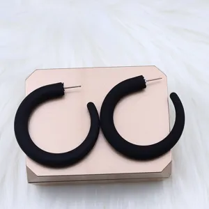 Stylish black chunky hoop earrings, minimalist geometric design for elegant wear.