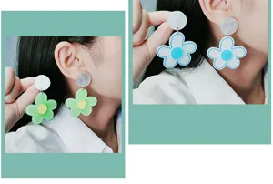 Acrylic flower earrings detail shot, showcasing the fresh multi-layer design on the ear model.