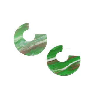Stylish C-shaped green marbled acrylic hoop earrings for women, minimalist geometric design.