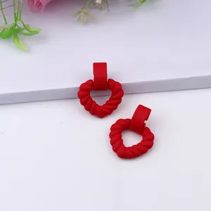 Red heart geometric acrylic stud earrings, simple chic style daily wear detail view.