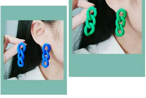 Closeup detail view of long 3-link acrylic chain drop earrings in vibrant blue and green colors.