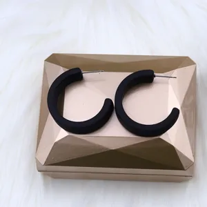 Matte black C-shaped hoop earrings for women, stylish minimalist geometric ear jewelry.