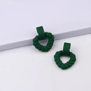 Dark green matte twisted heart acrylic earrings detail view, minimalist style for daily wear.