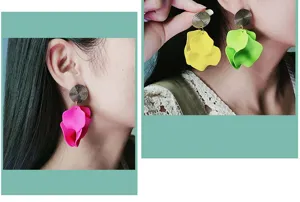 Detailed view of fashionable candy-colored petal drop earrings with metal textured studs.