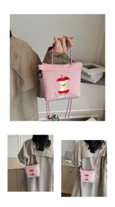 Cute Japanese style nylon shoulder bag with cartoon apple core embroidery and colorful braided strap.