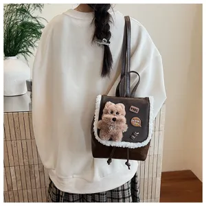 Brown PU leather mini backpack with cute plush teddy bear decor, chic casual style for women.