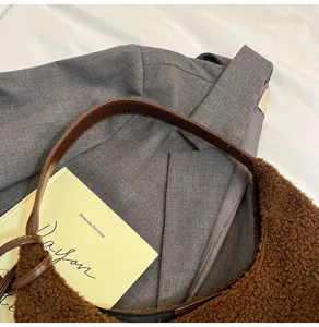 Brown faux shearling shoulder bag detail, soft plush tote bag for winter daily commuting stylish.