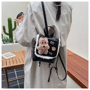 Detailed view of the cute teddy bear plush mini backpack with chic patches and leather design.