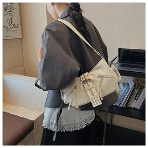 Cream white faux leather motorcycle shoulder bag with multi zippers and buckle strap design