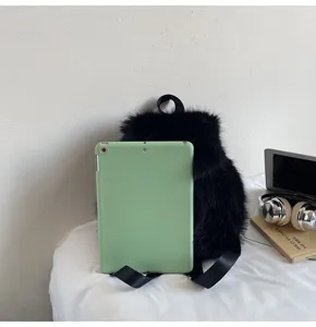 Detail shot of a stylish black fluffy plush backpack, soft winter casual daily bag.