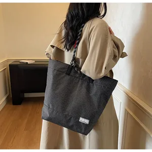 Classic black and grey plaid tote bag with rope handles, stylish shoulder bag for daily use.