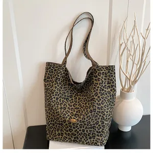 Stylish leopard print canvas tote bag for women, casual large capacity shoulder handbag.