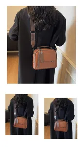 Braune Leder Umhängetasche mit breitem Gurt, minimalistische stilvolle Handtasche für Damen.