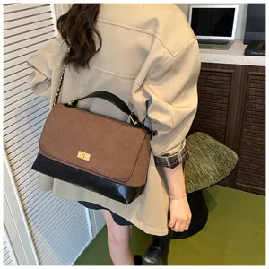 Stylish quilted shoulder bag with chain strap, patchwork design for commuting and daily wear.