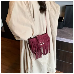 Suede fringe crossbody bag for women, retro casual shoulder bag with metal buckle detail.