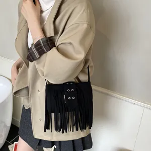 Black suede fringe crossbody bag for women, retro casual shoulder saddle bag with metal buckle.