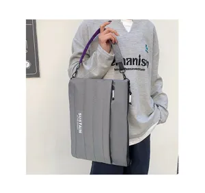Graue gesteppte 14-Zoll Laptoptasche mit Gurt, lässige Umhängetasche für Arbeit und Alltag.