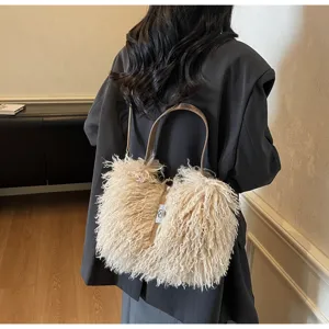 Stylish autumn winter fuzzy plush crossbody shoulder bag for women with metal handle design.
