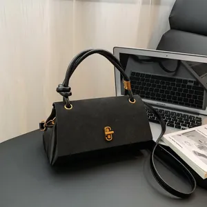 Black suede patchwork handbag for women, fashion retro top-handle crossbody bag style.