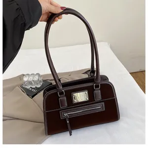 Retro braune Samt Achseltasche Schultertasche Detail mit hochwertiger Textur und Reißverschluss.