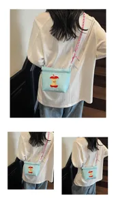 Detailed view of cute Japanese cartoon embroidered nylon crossbody bag, casual shoulder tote.