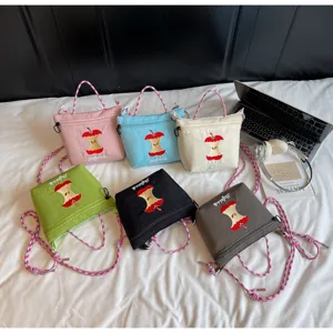 Cute Japanese style nylon crossbody shoulder bag with apple embroidery and colorful straps, multi-color.
