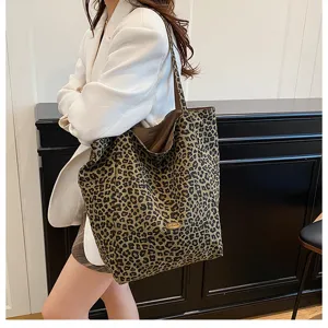 Detail shot of a stylish leopard print canvas tote bag, featuring spacious casual design.