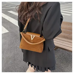 Brown suede cross-body shoulder bag for women, chic vintage handbag with gold V hardware.