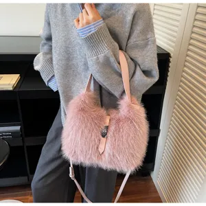 Pink plush bucket shoulder bag detail, featuring fluffy texture and metal lock closure.