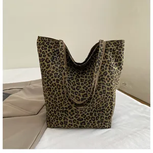 Stylish leopard print canvas tote bag for women, casual large capacity daily shoulder bag.
