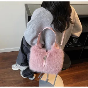 Plush faux fur bucket shoulder bag detail, elegant pink crossbody purse with lock closure for women.