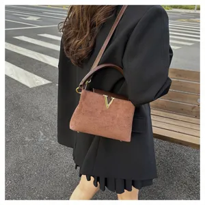 Retro brown suede crossbody shoulder bag with metal V clasp and leather handle for women.