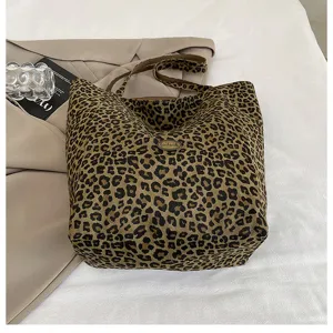 Detailed shot of the stylish leopard print canvas tote bag, showcasing casual style and large capacity.