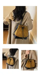 Zaino secchiello convertibile da donna, elegante borsa a tracolla trapuntata in pelle scamosciata.