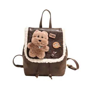 Brown mini PU leather backpack with white plush trim and cute fluffy bear plush toy design.