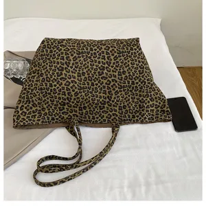 Detailed view of the casual leopard print canvas tote bag, showcasing texture and fabric.