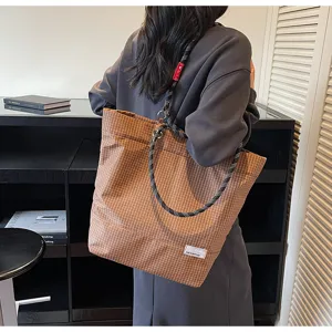 Casual brown plaid tote bag for women and men, large capacity canvas shoulder bag with rope strap.