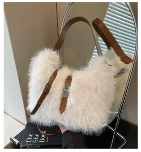 Winter plush shoulder bag for women, fluffy faux fur handbag with brown leather strap detail.
