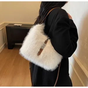 Stylish white plush shoulder bag for women, cozy faux fur crossbody purse with chic brown strap.