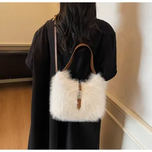 Plush shoulder messenger bag for women, stylish autumn winter fluffy bucket bag detail view.