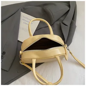 Minimalistische gelbe Bowling Umhängetasche für Damen, schicke PU Leder Handtasche.