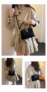 Stylish black suede crossbody bag with gold V logo for women, perfect for autumn commuting.