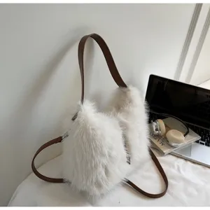 Chic fluffy plush bucket bag for women, stylish winter faux fur shoulder and crossbody handbag.