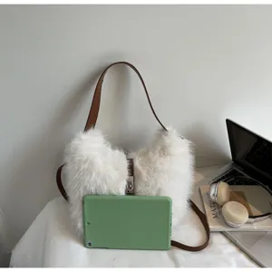 Chic white faux fur shoulder bag with brown strap, fluffy winter handbag for stylish women.